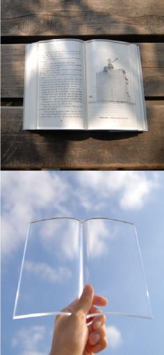 A transparent acrylic paper weight to hold down the pages of a book as you eat and drink while reading.