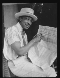 
                    
                        Man reading Indianapolis newspaper. Photograph by James Van Der Zee (American, 1886-1983).  Van Der Zee developed a passion for photography as a youth, and opened up his own Harlem studio in 1916. Van Der Zee became known for his detailed imagery of African-American life, and for capturing celebrities such as Florence Mills and Adam Clayton Powell Jr. Source:http://books0977.tumblr.com/
                    
                