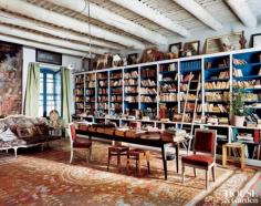 
                    
                        In a home in Provence, France, the library's shelves hold a collection of books and magazines, vintage toys and mirrors. #houseandgarden #blue
                    
                