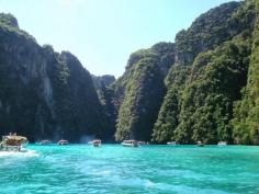 
                    
                        The Phi Phi Islands  are located in Thailand, between the large island of Phuket and the western Strait of Malacca coast of the mainland.
                    
                