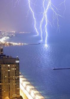
                    
                        Long exposure image of lightning on Lake Michigan, USA
                    
                