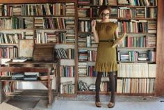 
                    
                        Model choosing a book to read in a dress by Eva Franco, Fall 2011 collection.  The collection has a vintage feel and the dresses are exquisitely tailored and detailed. There is an English countryside influence in the Fall 2011 collection.  Source: books0977.tumblr....
                    
                