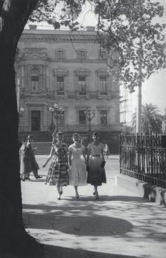 What's not to love: the lighting; the Fifties dresses...! Young ladies on Collins Street, Melbourne, 1950s.