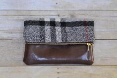 
                    
                        Wool plaid and faux leather fold over clutch    This plaid and faux leather clutch is perfect for a night on the town with the girls or date night
                    
                