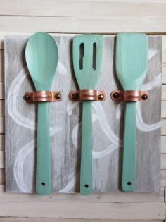 
                    
                        Make unique art for your kitchen with copper pipe straps and wooden utensils!
                    
                