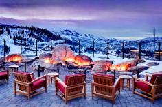 
                    
                        Snowy mountain scenery from patio with fire pits
                    
                