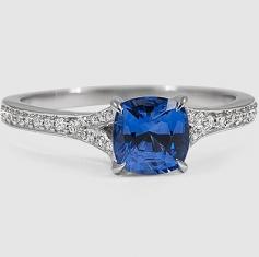 
                    
                        A cushion blue sapphire sits beautifully in the Duet Diamond Ring.
                    
                