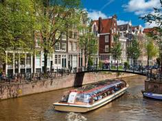 
                    
                        When in Amsterdam, grab some fried herring, a can of Heineken, and hop on a canal tour.
                    
                