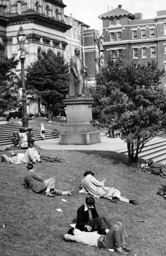 
                    
                        1951: People relax on the lawns outside the State Library of Victoria. Old Queen Victoria Hospital in the background
                    
                