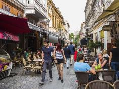 
                    
                        Picture of people walking through old town Bucharest
                    
                