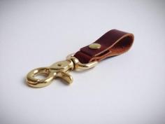 
                    
                        Rustic brown leather key fob with brass
                    
                