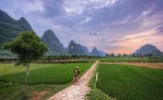 
                    
                        A man cycles off into the sunset through the hills of Yangshuo in Southern China (From: 12 GORGEOUS Images of the 'Golden Hour' Around the World)
                    
                