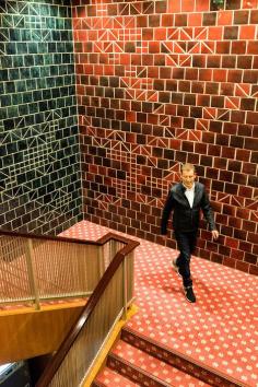 
                    
                        Designer Tomas Maier on the Hotel Okura’s geometrically tiled staircase.
                    
                