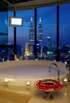 Bathtub City View ... An evening view of the Petronas Twin Towers from the Westin Hotel in Kuala Lumper in  Malaysia ... Now thats a sexy bubble bath ~Crystaline