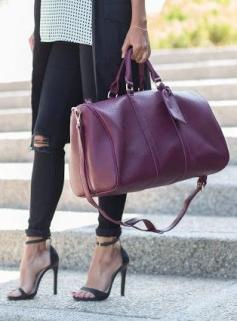 
                    
                        Oxblood weekender bag by Sole Society
                    
                