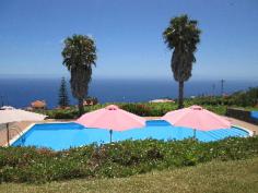 A pleasant hotel in beautiful green surroundings, this hotel is in a lovely location and perfect for those who love the outdoors. The hotel sits in Madeira's Estreito da Calheta, and apart from the abundant greenery also offers great sea views. The hotel is just 52km from Madeira international airport and guests can easily visit the awe inspiring Sao Vicente caves that are just over 30km away. For lazy days at the hotel guests can enjoy the great outdoor pool and solarium, or work out at the fitness centre and even enjoy a massage. Bikes are a great way to explore the beautiful surroundings and they are available for free. The hotel has a restaurant that overlooks the gardens and pool and offers national and regional food, there is also a snack bar. The pleasantly decorated rooms overlook the gardens and feature a seating area, satellite TV and free Wi-Fi.