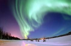 Aurora Borealis Over a Christmas Landscape in Alaska