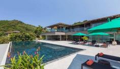 Welcome one of Phuket ’s most illustrious villas, this house exudes luxury and opulence with its spacious living areas, an infinity pool, two expansive chefs kitchens, 6 luxury bedrooms and large decks that look out to Ao Yon Bay. Book with Villa Getaways.

