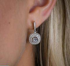 The Ida Drop Earrings are Exceptionally Stunning, due to their sparkly, dangling pear shaped center stone design. The 4mm white pear shaped center stone is surrounded by .069mm white pavé with an upper overlay of pavé prong set detail.